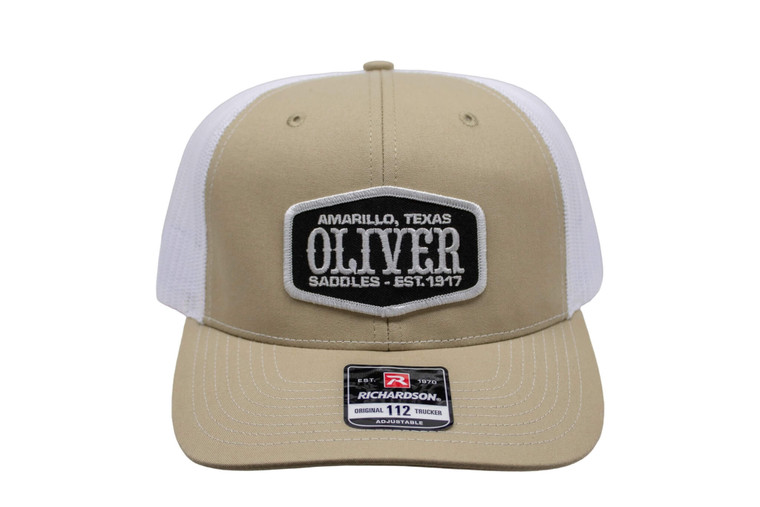 Tan Oliver Saddle Shop hat with black patch.