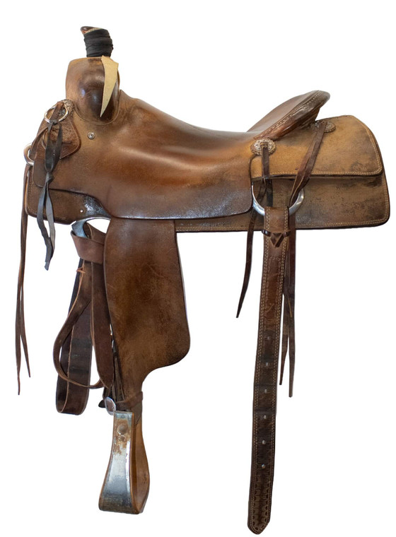 Left image of used 17" Tad Sanders ranch cutter saddle.