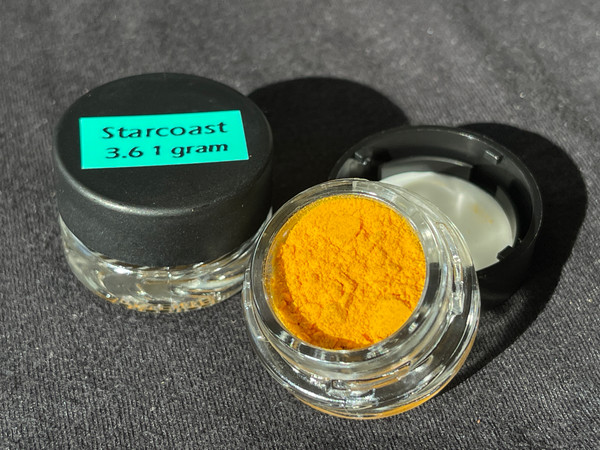 Starcoast Batch 3.6 in a glass jar, open to display the powder