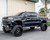 Lifted Silverado pickup showing a taller upgraded stance