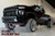 Raised Chevrolet HD truck parked after lift installation