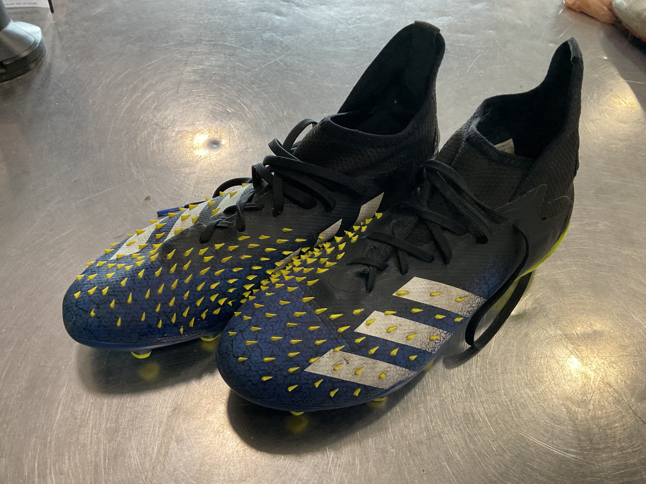 navy blue and yellow football cleats