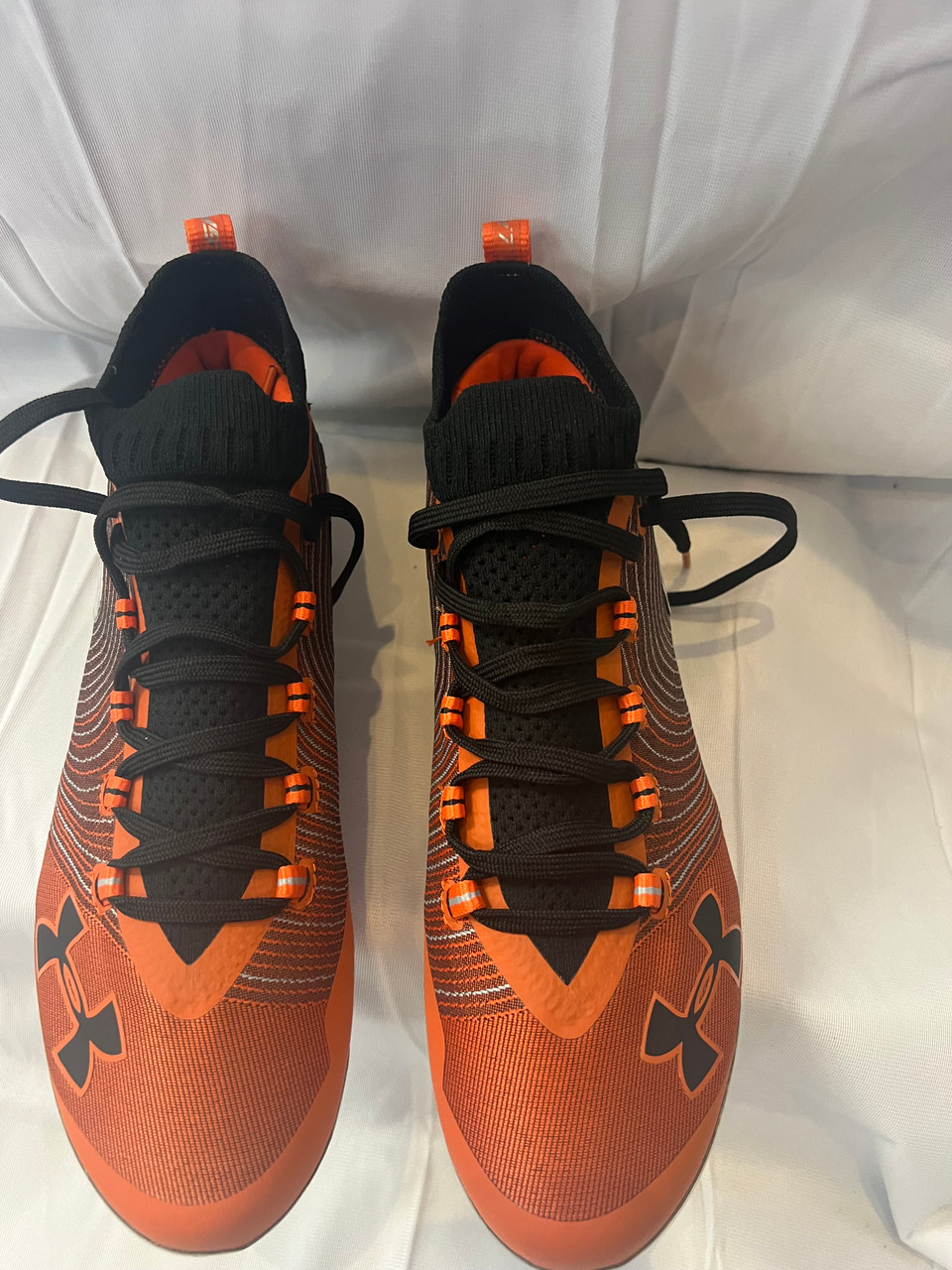 under armour orange and black cleats