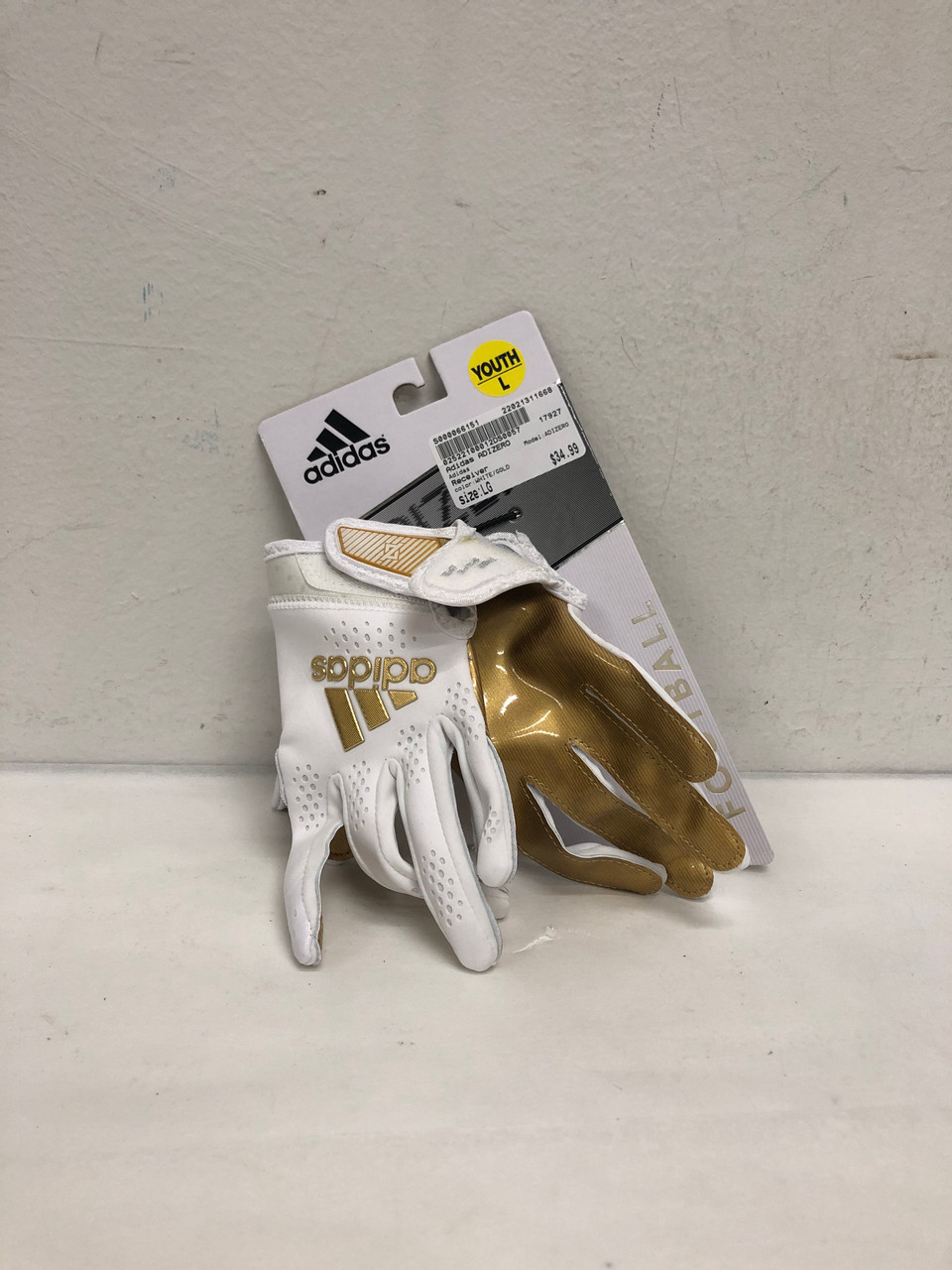 white and gold adidas football gloves