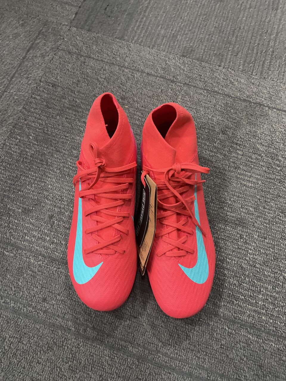 coral nike cleats