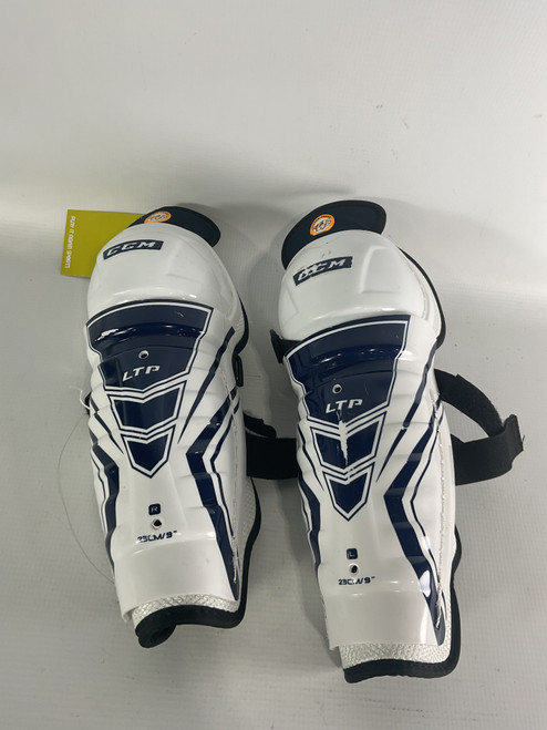 Vist Large View of Product Image Which is Used CCM JR PEDS Youth Shin Guards Clear And Royal Blue 9" 11834-S000030268