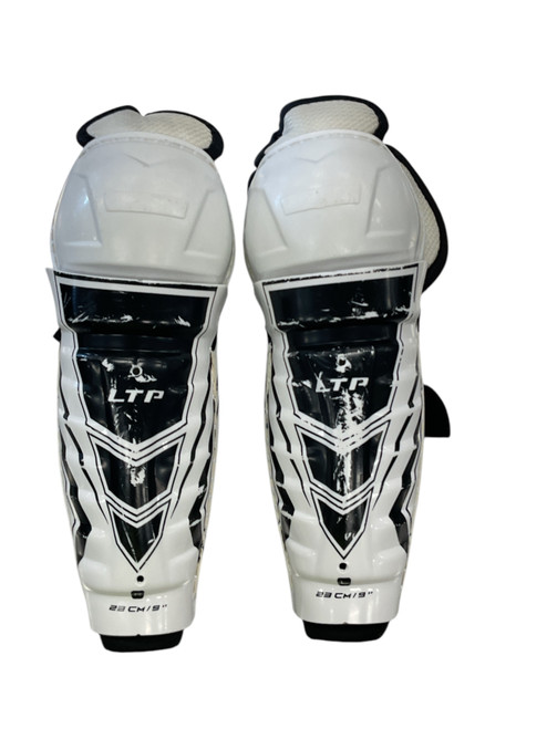 Vist Large View of Product Image Which is Used CCM LTP Youth Shin Guards White 9"
