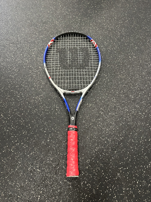 Vist Large View of Product Image Which is Used Wilson SAMPRAS GRAND SLAM Adult Tennis Racquet Royal Blue 4 1/2"