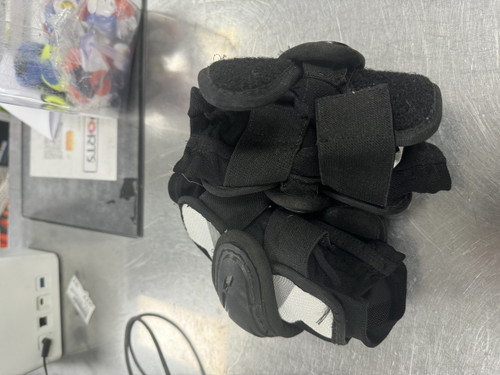 Vist Large View of Product Image Which is Used Under Armour BLACK ARM PADS Lacrosse Arm Pads/Guards Black XS 11849-S000026354