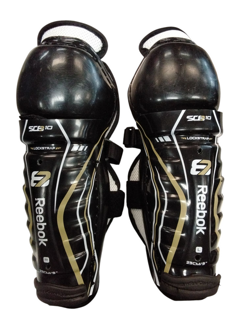Vist Large View of Product Image Which is Used Reebok SC8 10 Youth Shin Guards Black 9" 11866-S000023279