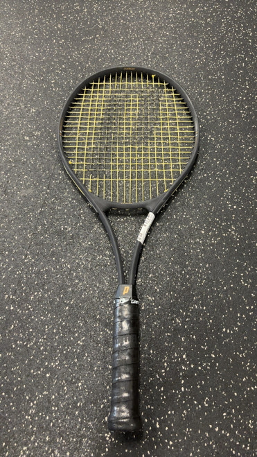 Vist Large View of Product Image Which is Used Prince PRO OVERSIZE Adult Tennis Racquet Black 4 1/2"