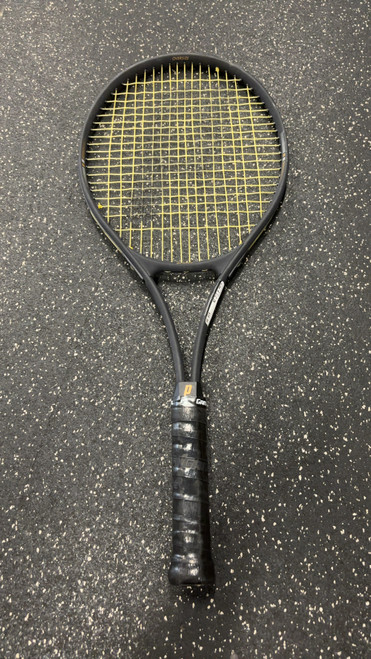 Vist Large View of Product Image Which is Used Prince PRO OVERSIZE Adult Tennis Racquet Black 4 1/2"
