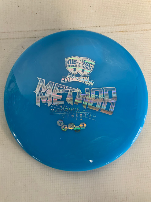 Vist Large View of Product Image Which is Used Discmania METHOD NEO Disc Golf Mid Range Carolina Blue 177g