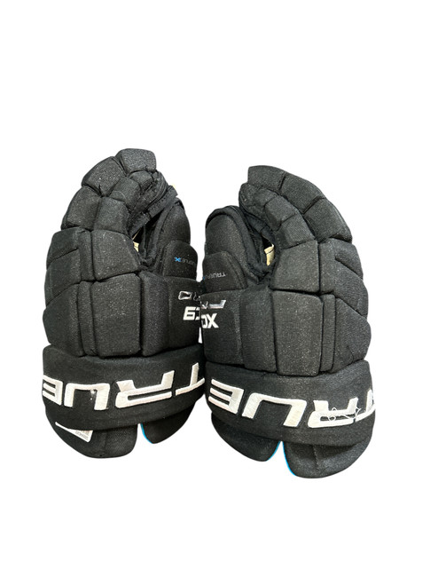 Vist Large View of Product Image Which is Used True XC9 PRO GLOVES 12IN Junior Gloves Black And Carolina Blue 12" 11631-S000446302