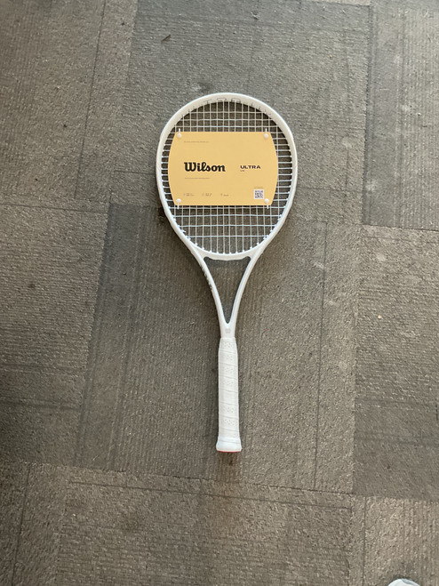 Vist Large View of Product Image Which is Used Wilson ULTRA UV Adult Tennis Racquet White 3 3/8" 11614-S000218000