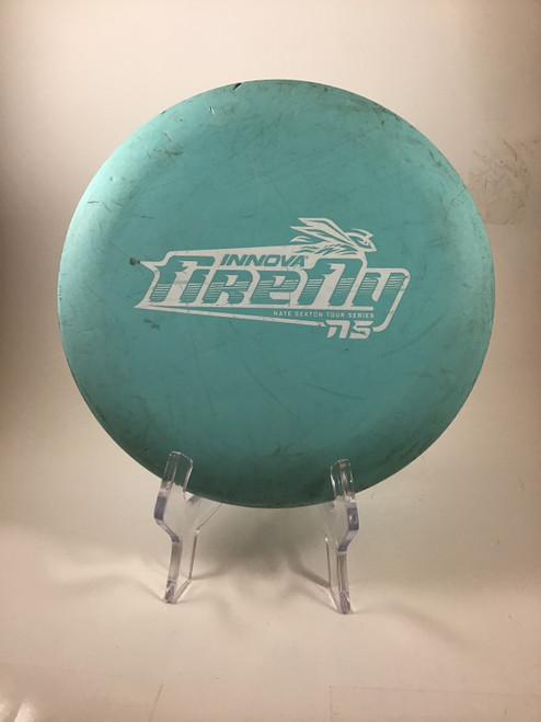 Vist Large View of Product Image Which is Used Innova XT FIREFLY Disc Golf Putter Turquoise 175g