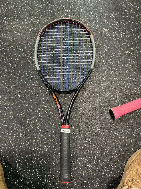 Vist Large View of Product Image Which is Used Wilson BURN 100 Adult Tennis Racquet Orange 4 1/2"