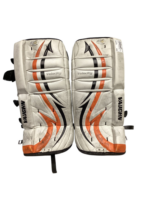 Vist Large View of Product Image Which is Used Vaughn VELOCITY 7100 Goalie Leg Pads Youth Orange 20"