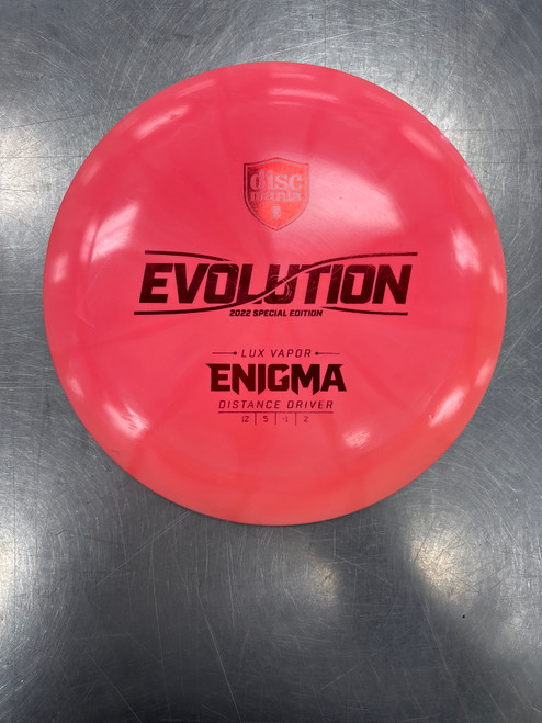 Vist Large View of Product Image Which is Used Discmania LUX VAPOR ENIGMA Disc Golf Driver Pink