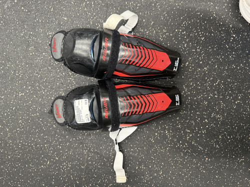 Vist Large View of Product Image Which is Used Bauer LIL SPORT Youth Shin Guards Black 9"