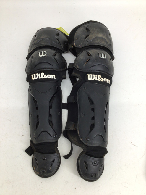 Vist Large View of Product Image Which is Used Wilson CATCHER JUNIOR SHINGUARDS Catchers Leg Guards Black Junior