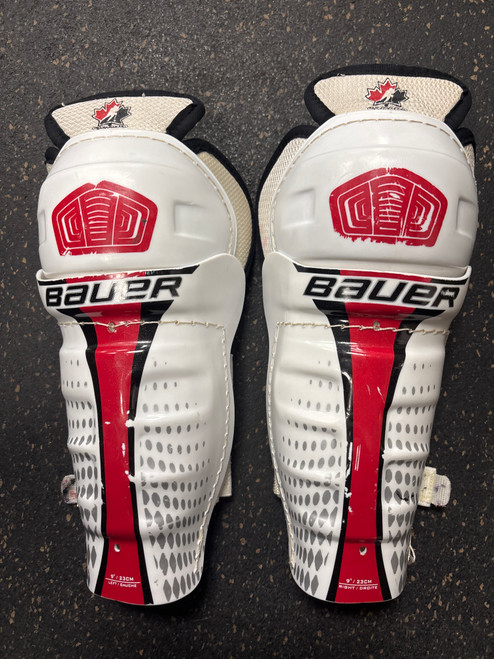 Vist Large View of Product Image Which is Used Bauer CANADA Youth Shin Guards White 9"
