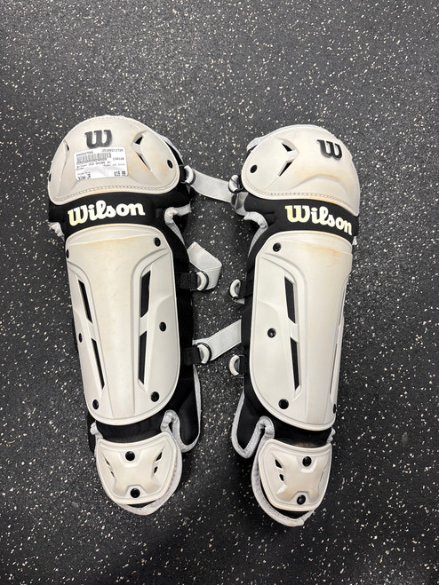 Vist Large View of Product Image Which is Used Wilson JGZ SHINS Catchers Leg Guards Grey Junior