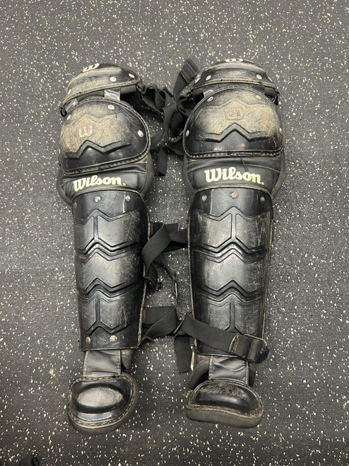 Vist Large View of Product Image Which is Used Wilson Catchers Leg Guards Black Junior