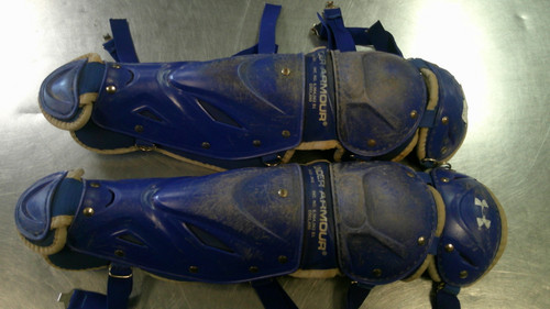 Vist Large View of Product Image Which is Used Under Armour UALG2-JRVS Catchers Leg Guards Royal Blue Intermed