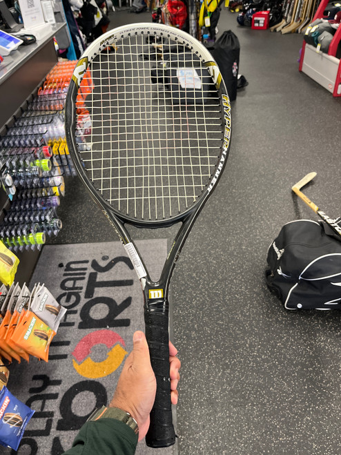 Vist Large View of Product Image Which is Used Wilson HYPER HAMMER 5.3 Adult Tennis Racquet Black 4 1/4"