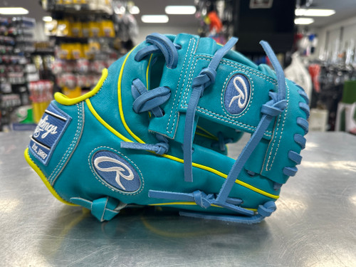 Vist Large View of Product Image Which is Used Rawlings PROR234U-2TEY HEART OF THE HIDE BB/SB Glove RH Throw Teal 11 1/2"