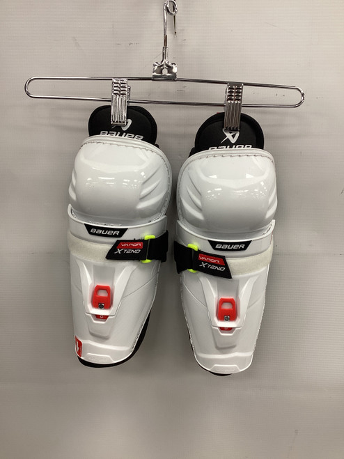 Vist Large View of Product Image Which is Used Bauer X TENO Youth Shin Guards White 8"