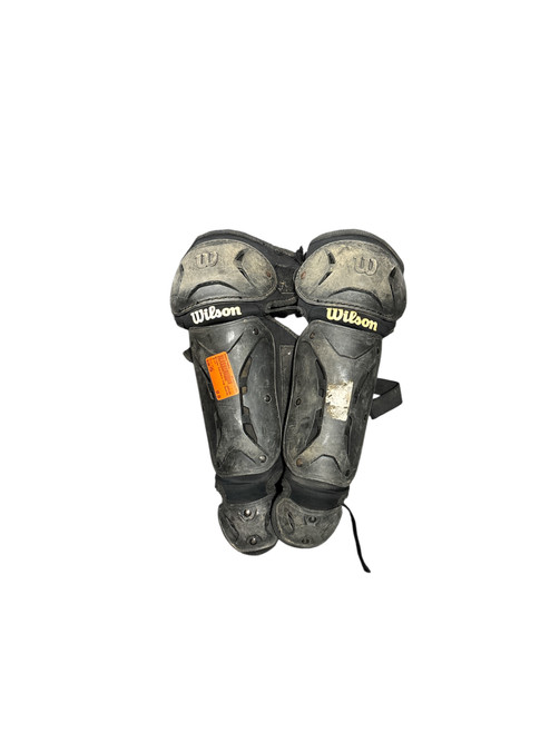 Vist Large View of Product Image Which is Used Wilson Catchers Leg Guards Black Youth