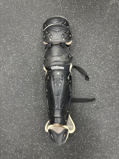 Vist Large View of Product Image Which is Used Wilson WTA4602 Catchers Leg Guards Black Intermed