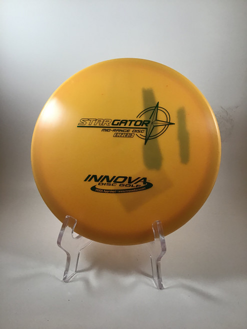 Vist Large View of Product Image Which is Used Innova STAR GATOR Disc Golf Mid Range Orange 174g