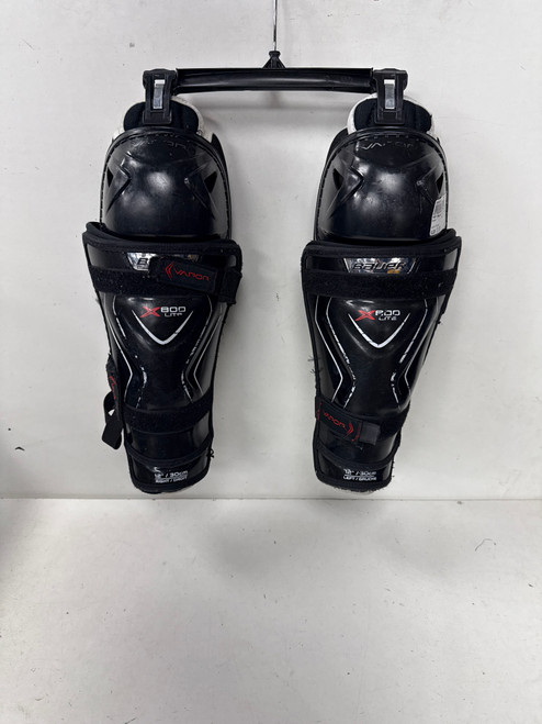Vist Large View of Product Image Which is Used Bauer VAPOR X800 LITE Junior Shin Guards Black 12"
