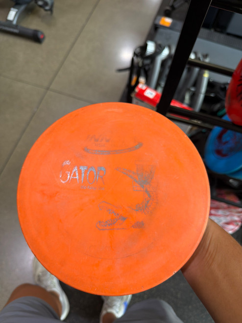 Vist Large View of Product Image Which is Used Innova GATOR Disc Golf Mid Range Orange