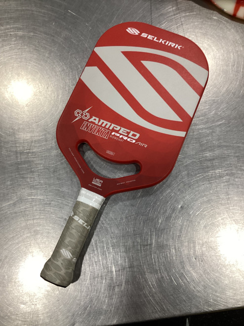 Vist Large View of Product Image Which is Used Selkirk AMPED PRO AIR INVICTA Pickleball Racquet Red