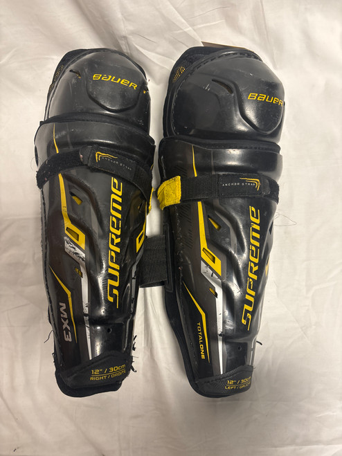 Vist Large View of Product Image Which is Used Bauer TOTAL ONE MX3 Junior Shin Guards Black 12"