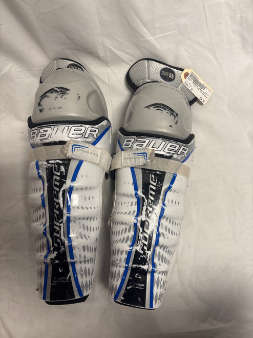 Vist Large View of Product Image Which is Used Bauer SUPREME ONE55 Junior Shin Guards White 11"
