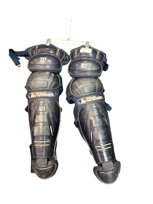 Vist Large View of Product Image Which is Used Wilson BLUE SHIN GUARDS INT Catchers Leg Guards Navy Blue Intermed