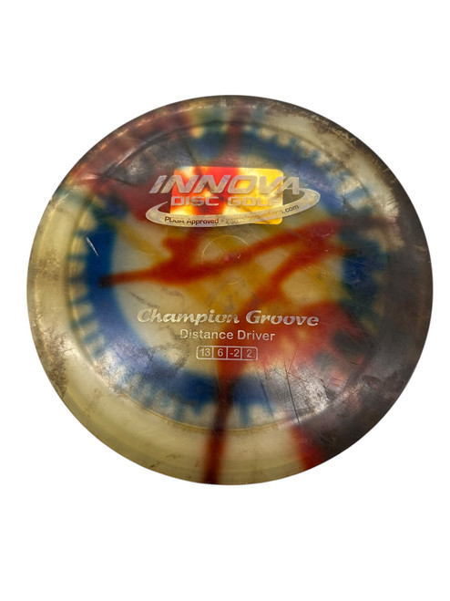 Vist Large View of Product Image Which is Used Innova CHAMPION GROOVE TYE DYE Disc Golf Driver White