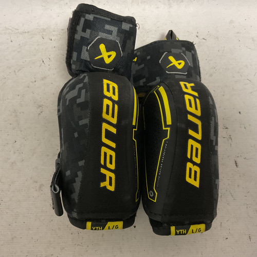 Vist Large View of Product Image Which is Used Bauer SUPREME MACH Youth Elbow Pads Black And Optic Yellow LG