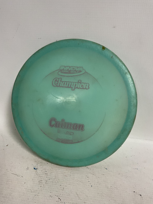Vist Large View of Product Image Which is Used Innova CHAMPION CAIMAN Disc Golf Mid Range Teal