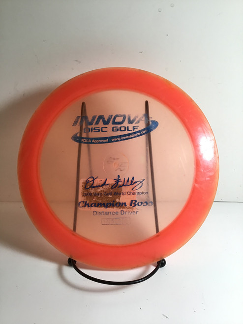 Vist Large View of Product Image Which is Used Innova CHAMPION BOSS Disc Golf Driver Pink 175g