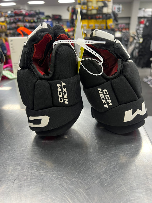 Vist Large View of Product Image Which is Used CCM NEXT Youth Gloves Black 9"