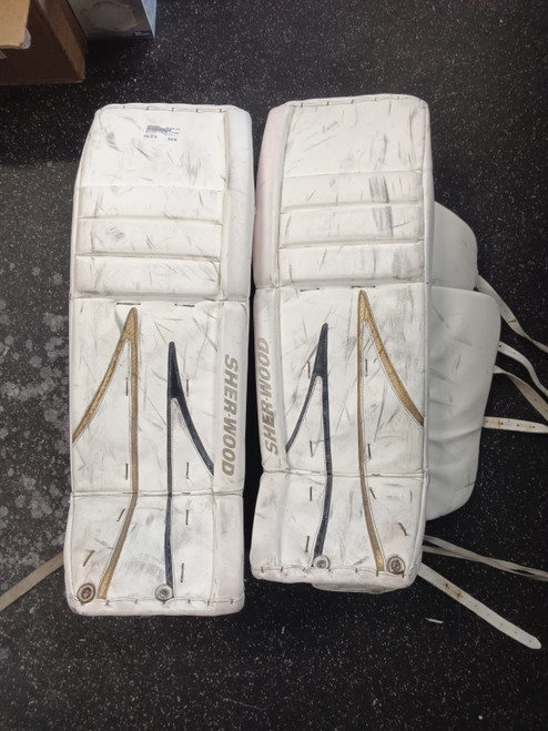 Vist Large View of Product Image Which is Used Sher-wood T 95 33 +1 Goalie Leg Pads Senior White 33"