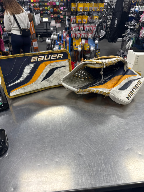 Vist Large View of Product Image Which is Used Bauer REACTOR 4000 Intermediate Goalie Trapper & Blocker Set Navy Blue And Yellow