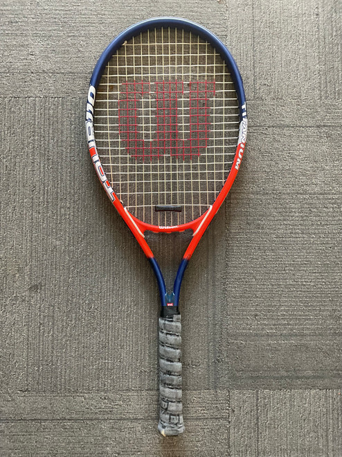 Vist Large View of Product Image Which is Used Wilson TOUR 110 Adult Tennis Racquet Orange 4 3/8"