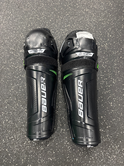 Vist Large View of Product Image Which is Used Bauer X SHINS Junior Shin Guards Black 12"